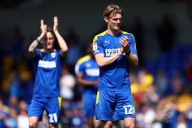 AFC Wimbledon midfielder Jack Rudoni has caught the eye of Huddersfield Town, Sunderland and Bristol City.