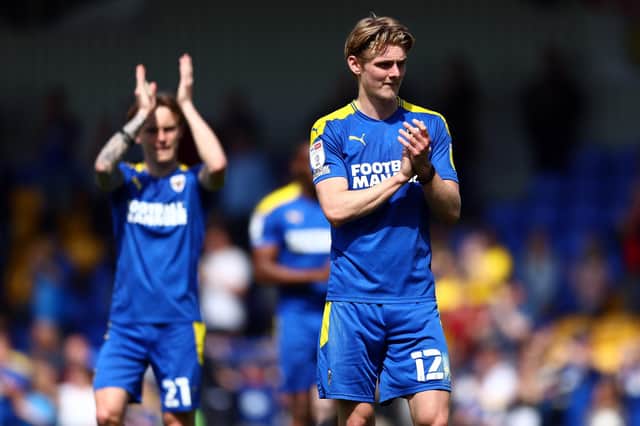 AFC Wimbledon midfielder Jack Rudoni has caught the eye of Huddersfield Town, Sunderland and Bristol City.