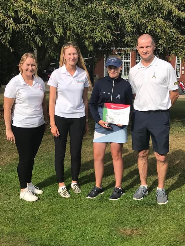 Abigail Scott receives the England Golf Hero’s Handshake award.