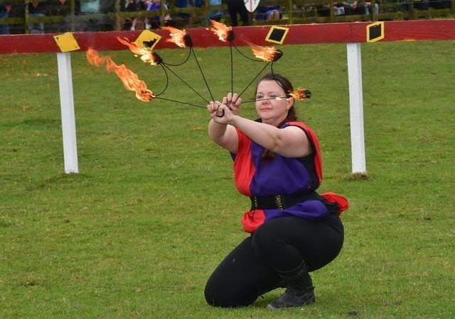 A fire juggling act by Maria Cuthbert.