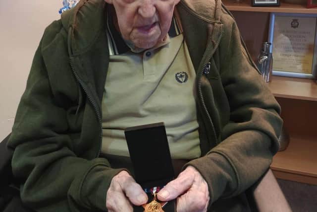 George with his Arctic Start medal presented on his 104th birthday