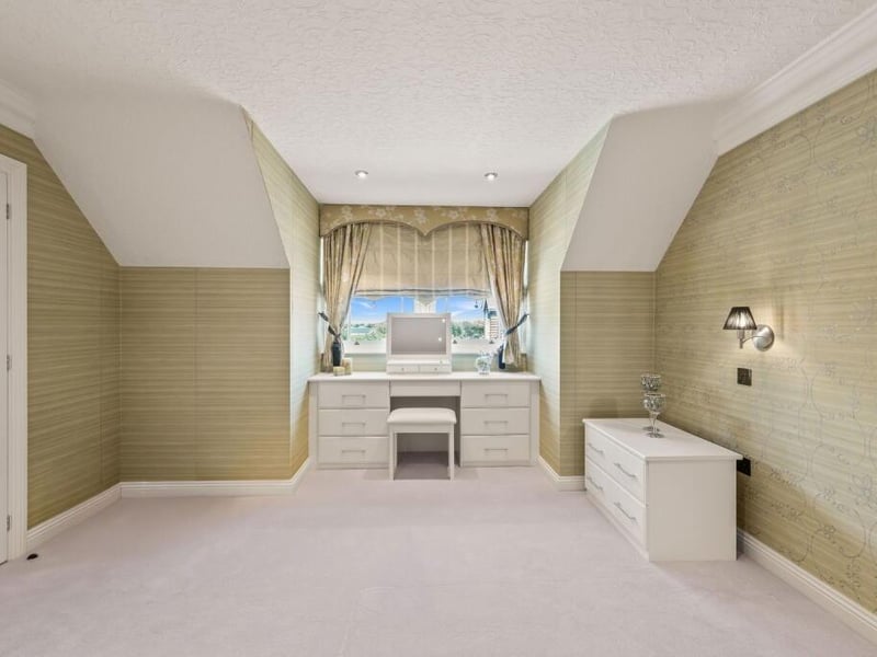 The second first-floor bedroom and ...