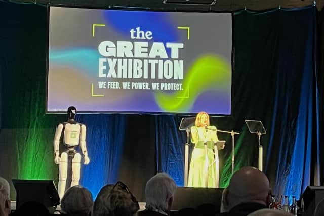 Dame Andrea Jenkyns is joined by a robot on stage at the exhibition. Photo: LDRS