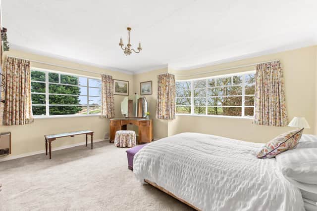 One of the bedrooms, with the curving Crittall windows on show.