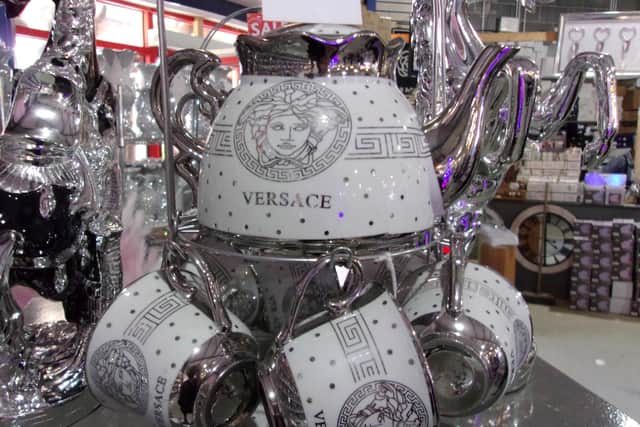 Some counterfeit Versace mugs and teapot.