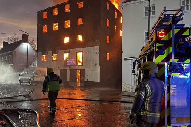 Firefighters on scene at the height of the blaze in the old warehouse on London Road, Boston. Photo: Matt King