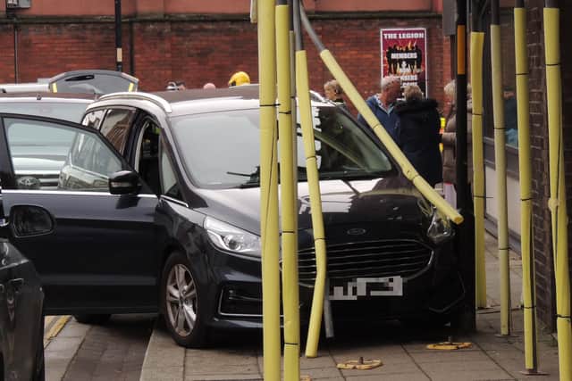 The car crashed into scaffolding just metres from security staff on the road block for Remembrance Sunday.