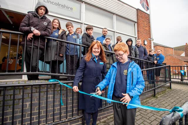 Jack Wells from LWF St Lawrence School with Kerry Dixon cutting the ribbon.