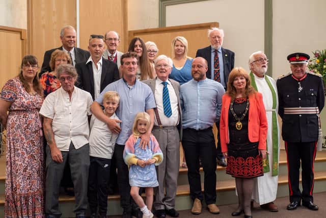 Peter Maddison with his family at the service.