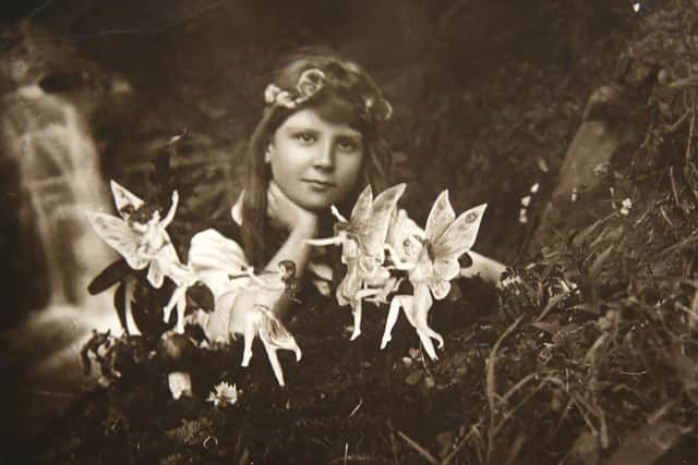 Frances Griffiths seen in one of the photographs that entranced the world.