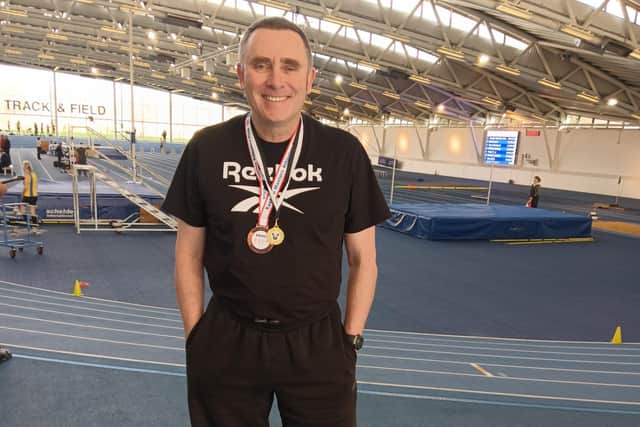Jim Gillespie with his medals in London.