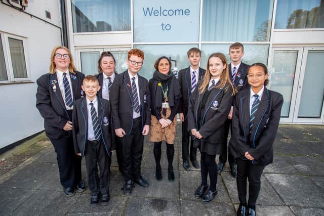 Barnes Wallis's Head of School Miss Charlotte Dunsford with pupils celebrating their 'Good' Ofsted.