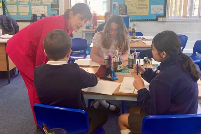 Cjatting to pupils in class at Grainthorpe Junior School.
