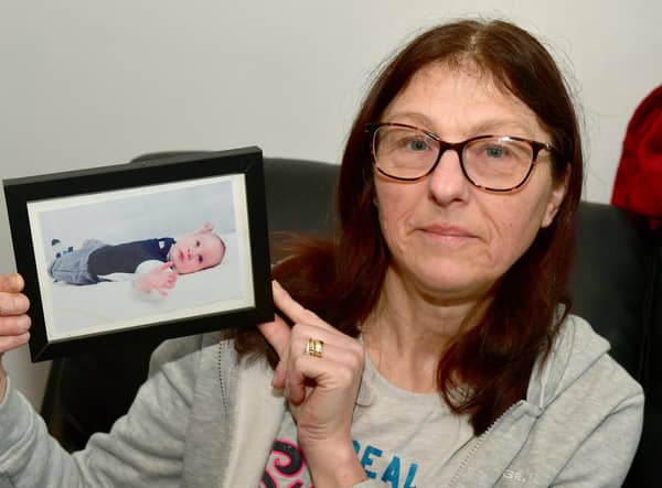 Hayley Marson, of Swineshead, with a photo of her baby grandson.