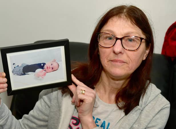 Hayley Marson, of Swineshead, with a photo of her baby grandson.