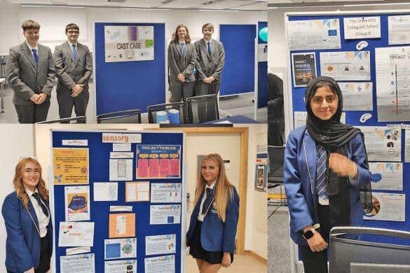 Students standing with their presentations.