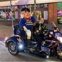 The Jolly Fisherman having the ride of his life on the Skegness Light Parade.