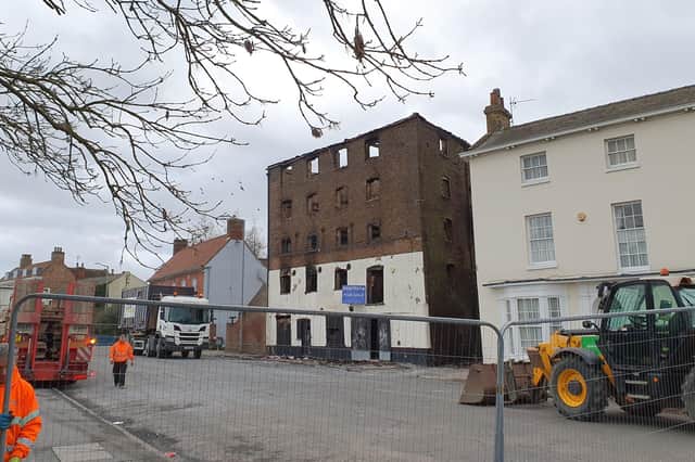 The building pictured today with the security fencing back in position.