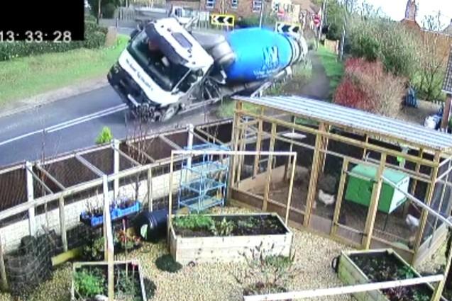 A still from Mr Pearson's CCTV footage as the cement trucks tips up while navigating the tight bend back in 2022.
