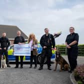 Lincolnshire Police Dosg Section present over £2,000 to the NFRSA and founder Lady Bathurst.