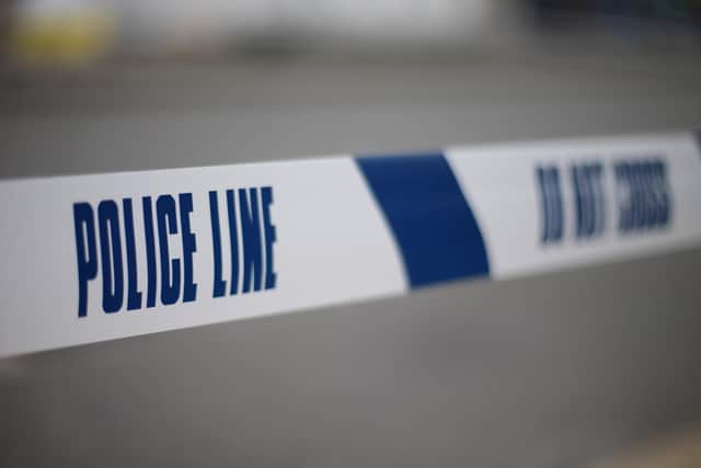 Police tape mark the cordoned off area on the junction of Church Road and Conley Road in Harlesden, north west London, after a man was shot dead the previous evening.