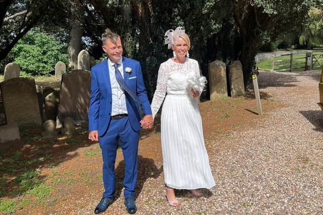 Sylvia and Alan pictured outside the church.