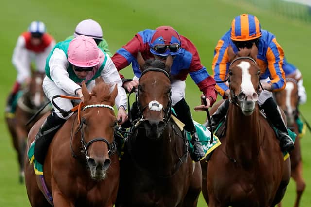 The 1000 Guineas favourite, Quadrilateral (left), wins a Group One race at Newmarket last season. (Photo by Alan Crowhurst/Getty Images)