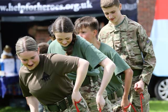 Air Cadets do their best at walking the plank at their coronation picnic.