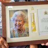 June and Dennis's framed and signed photo of The Queen.