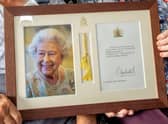 June and Dennis's framed and signed photo of The Queen.