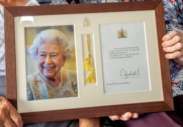June and Dennis's framed and signed photo of The Queen.