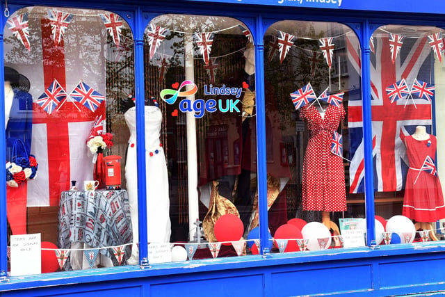 A shop window display in red, white and blue for the coronation.
