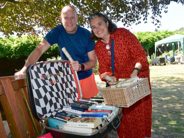 Steve and Steph Simpson, event volunteers, handing out 'story scrolls' to visitors at the Festival Of Storytelling.