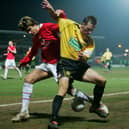 New Sleaford signing Shaun Harrad tussles with Manchester United's Gerard Pique during an FA Cup tie in 2006.
