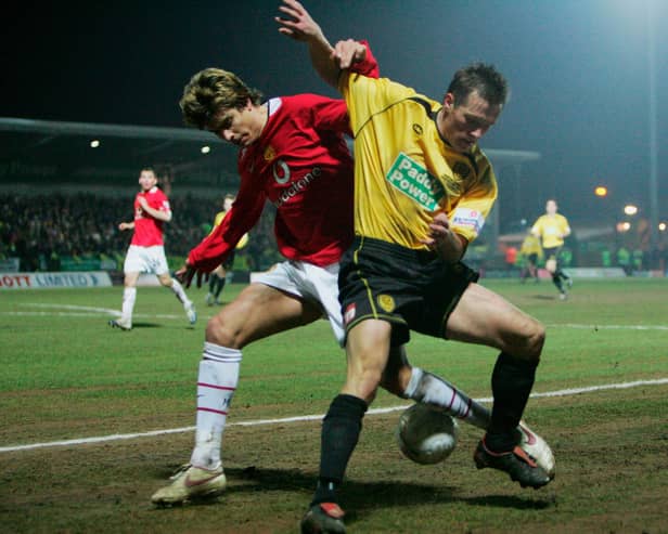 New Sleaford signing Shaun Harrad tussles with Manchester United's Gerard Pique during an FA Cup tie in 2006.