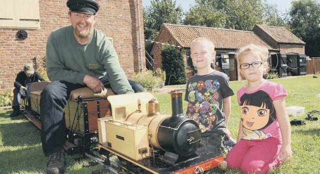Vintage fun with Evergreens Miniature Railway at the Village Church Farm Museum, in Skegness. Pictured are Martin Manning, with Liam Lloyd-Bevan, six, and Jemma Lloyd-Bevan, four.