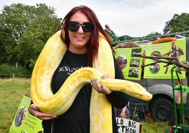 Nakita Firth, of Lincoln, holding a Burmese Python, owned by Al's Friendly Pets, Old Leake