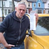 Iain Grant with his parking ticket.