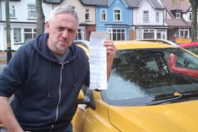 Iain Grant with his parking ticket.
