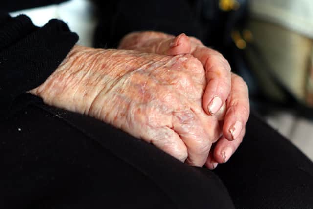 EMBARGOED TO 0001 THURSDAY NOVEMBER 3 File photo dated 7/10/2013 of the hands of an elderly woman at home, as a significant proportion of elderly people plan to cut back on the amount of money they spend on care amid the cost-of-living crisis, a new poll suggests.