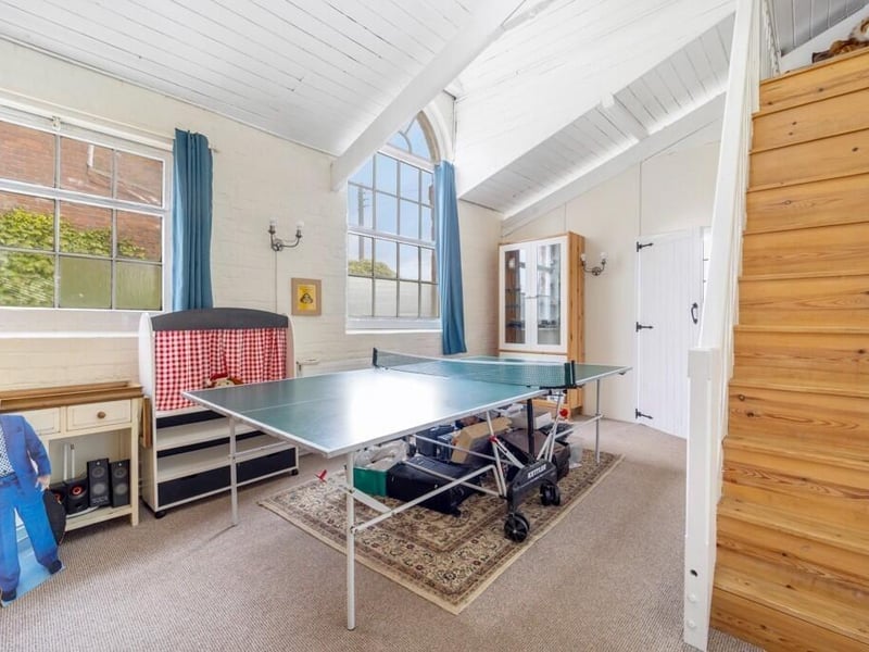 The games room, with steps leading to ...