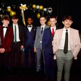 Fashion show models (from left) Kieran Brown, 15, Fletcher Newton, 15, Thomas Maynard, 15, Carlos Cardoso, 15, Joseph Wright, 15, Charlie Lowe, 15, and Breno Silva, 16.