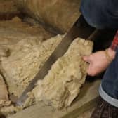File photo dated 14/11/17 of a person laying loft insulation. Barclays has extended its scheme to pay up to £2,000 to mortgage holders to help make their homes green as new research shows more than half of homeowners do not feel confident making their properties more energy efficient. Issue date: Thursday July 6, 2023.
