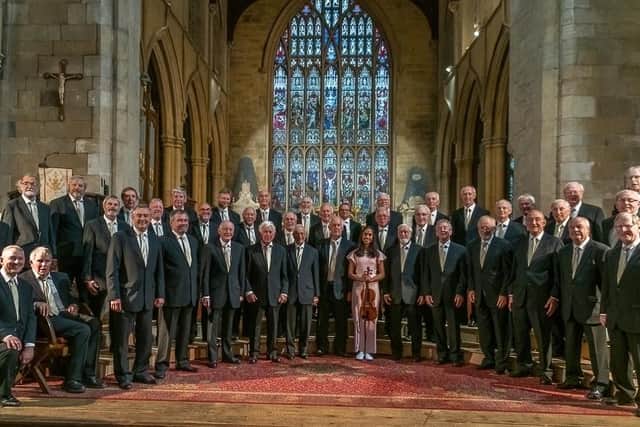 Louth Male Voice Choir pictured in a concert hosted by Queen Elizabeth's Grammar School in Horncastle with one of its pupils, Shivani Jansari, who won the young musician of the year title in 2019.
