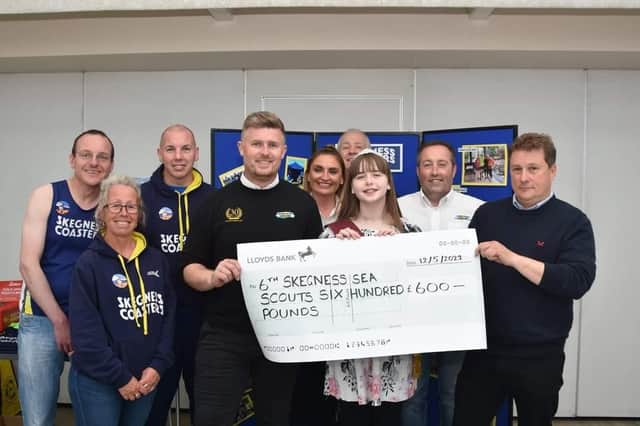 The 6th Skegness Sea Scouts receive their cheque from Skegness Coasters.