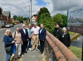 From left - Harriott Brand - Civic Trust, David Marriage - Civic Trust, Mark Bamford - Sleaford Museum, Doreen Bamford - Civic Trust, Chris Hodgson - Carre Gallery, Garry Titmus - Sleaford Heritage Group, Rob Oliver - services team leader for Sleaford Town Council, Mayor Coun Linda Edwards-Shea, unveiling the new sign at Castlefield.