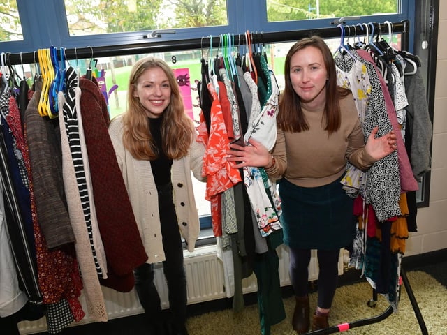 L-R Anja Nielsen and Michelle Robertson running the Clothes Swish at the Eco Village in Church Lane School.