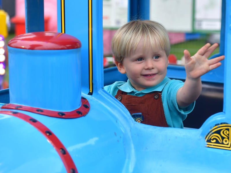 Archie Wilson 2 of Great Hale enjoys the funfair rides at the festvial.