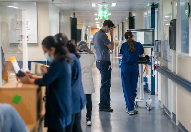 EMBARGOED TO 0001 MONDAY FEBRUARY 20 File photo dated 18/01/23 of a general view of staff on a NHS hospital ward at Ealing Hospital in London. Junior doctors in the Hospital Consultants and Specialists Association (HCSA) have said they will strike for the first time in the union's history next month in a dispute over pay. A ballot of training-grade doctors employed by NHS trusts in England in January saw 97.48% vote in favour of striking, on a 74.76% turnout. Issue date: Monday February 20, 2023.