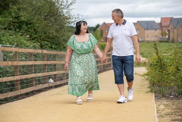 B&amp;DWC - SGB-266 - Karen and Craig walking through the Bourne based development